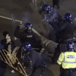 Policing using shields to strike protesters