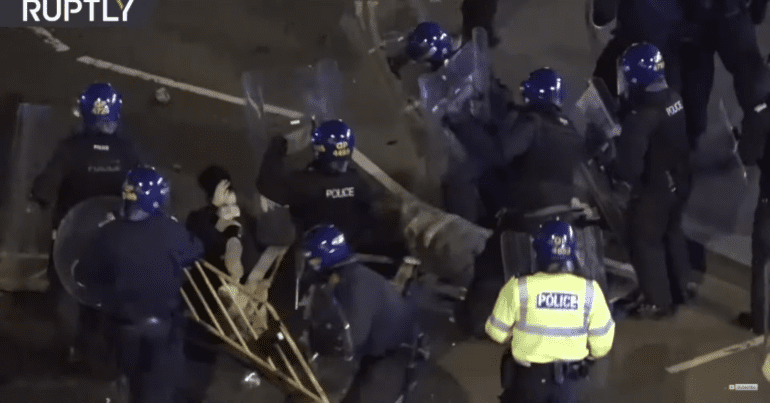 Policing using shields to strike protesters