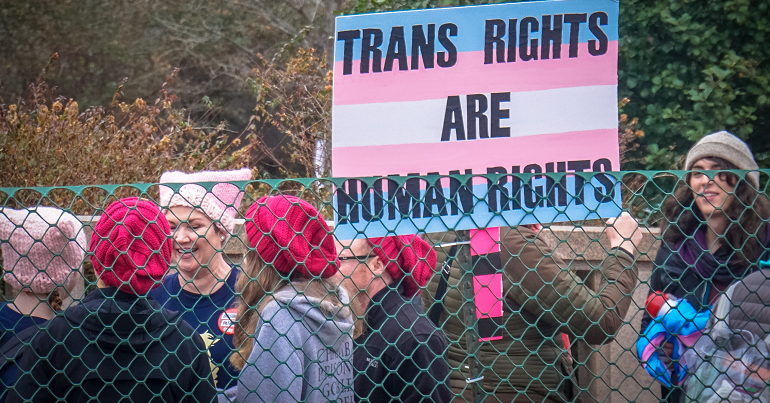 Protesters hold banner saying 'Trans rights are human rights'