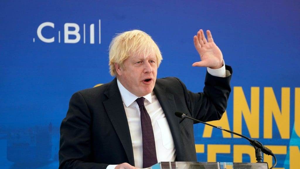 Boris Johnson holding his hand up