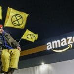 An XR activist outside Amazon on Black Friday