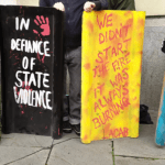 Protesters decorate riot shields, to symbolise self defence - At the trial of Ryan Roberts