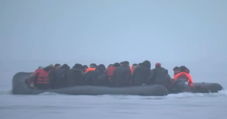 Refugees on a dinghy leaving Calais