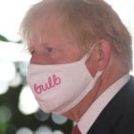 Boris Johnson wearing a face mask with the bulb logo on it