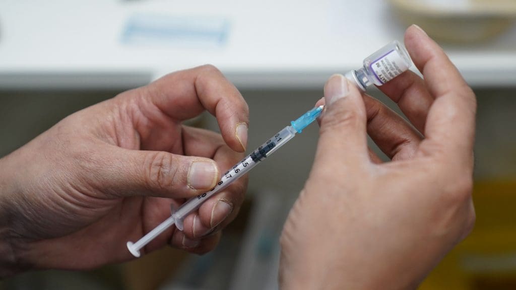 A syringe with a dose of vaccine