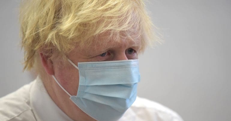 Boris Johnson wearing a mask