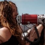 Campaigner speaking into a bullhorn