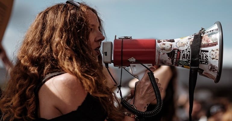 Campaigner speaking into a bullhorn