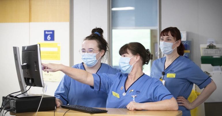 Nurses at work in face masks