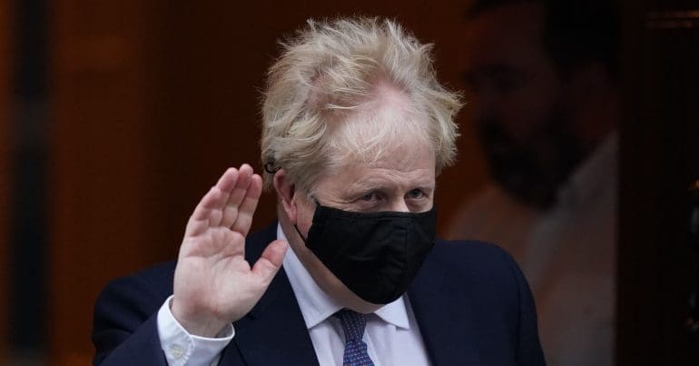 Boris Johnson waving his hand