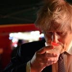 Boris Johnson drinking some sort of cocktail