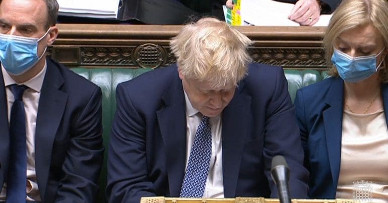 Boris Johnson with his head hung down