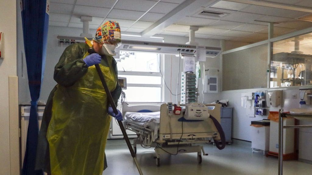 Hospital cleaners wearing face masks