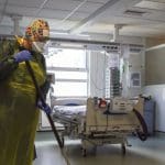 Hospital cleaners wearing face masks