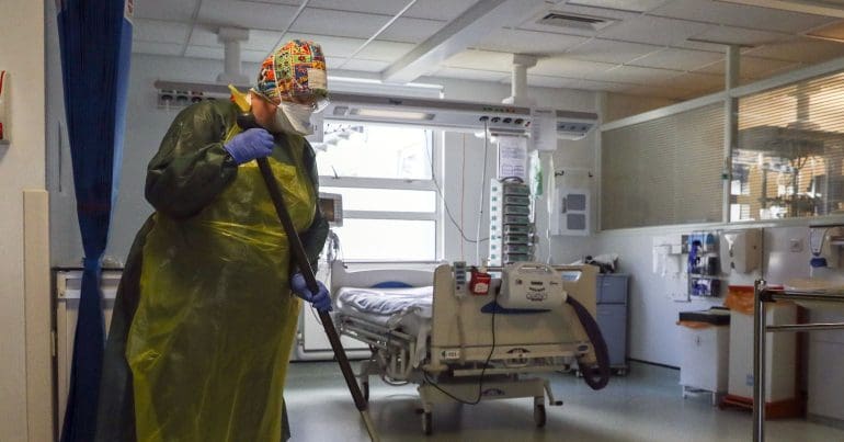 Hospital cleaners wearing face masks