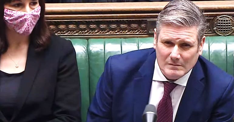 Labour leader Keir Starmer squinting in parliament
