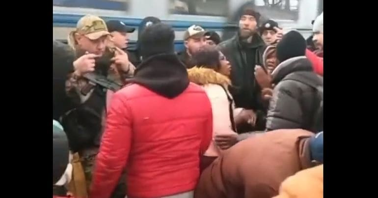 People waiting on a train platform in Ukraine
