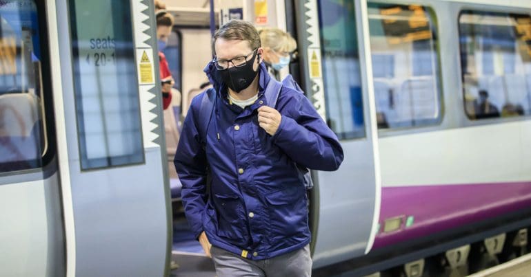 Commuters disembarking a train