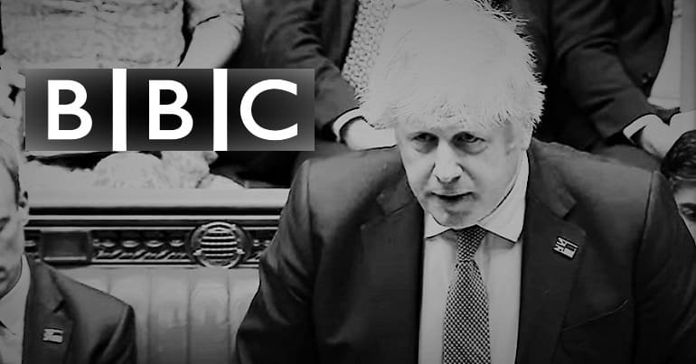 Boris Johnson looking at the BBC Logo