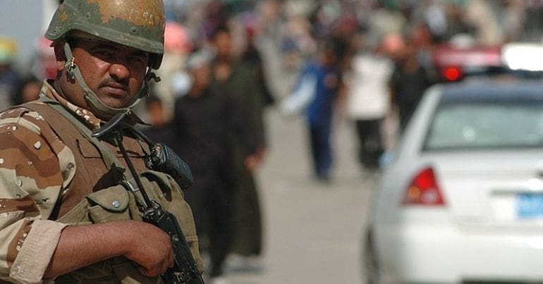 Iraqi soldier stands guard at checkpoint