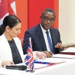 Priti Patel signing papers