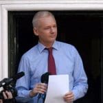 Julian Assange gives a speech from the Embassy