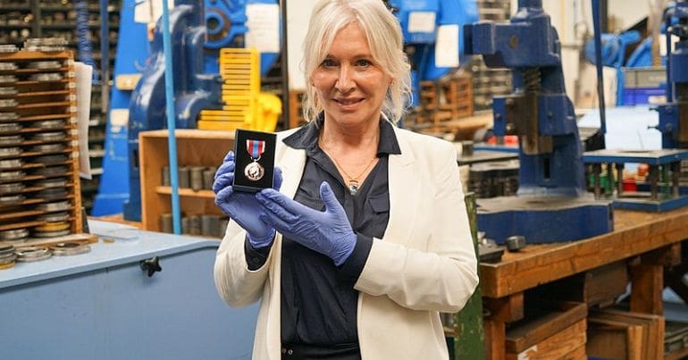 Nadine Dorries holding a medal