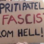 Placard that reads Priti Patel, Fascist from Hell! ACAB