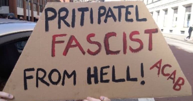 Placard that reads Priti Patel, Fascist from Hell! ACAB