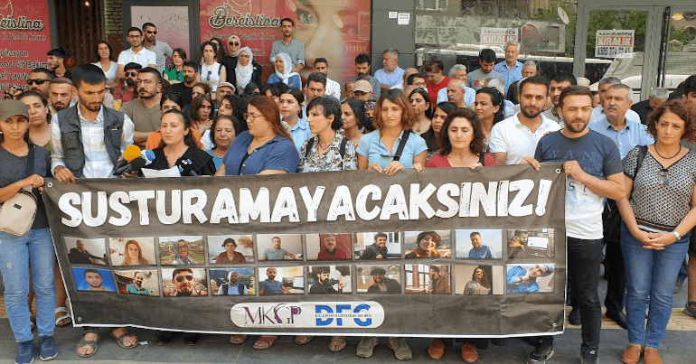 Journalists' organisations read out a solidarity message outside the office of Jin News