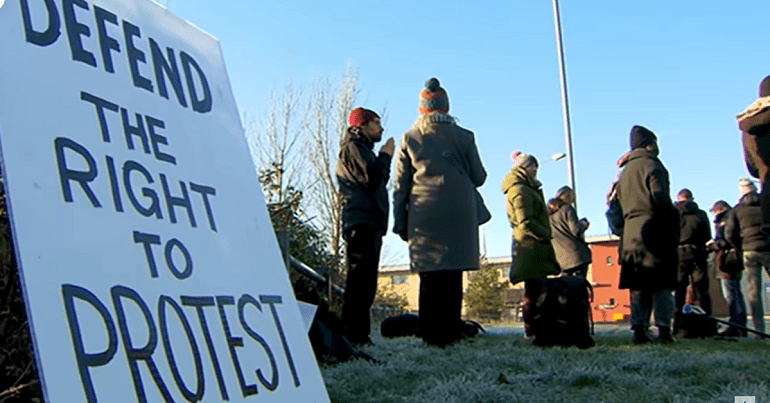 Placard reading 'Defend the right to protest'