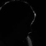 A woman in shadow representing chronic illness chronically ill DWP