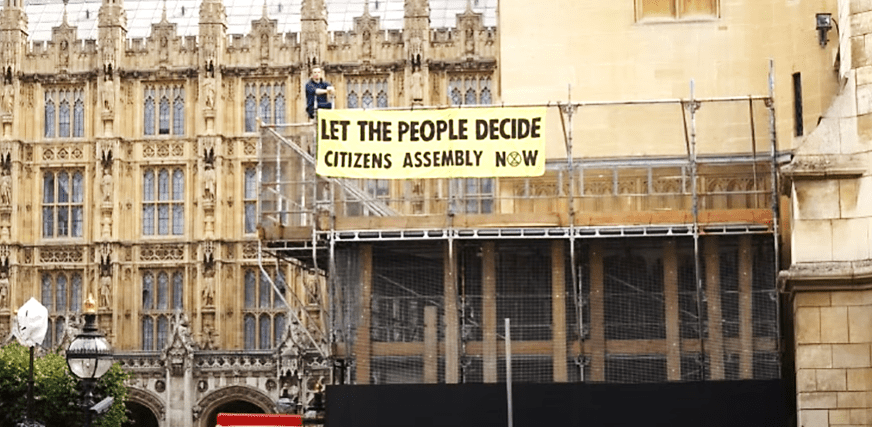 An XR banner attached to parliament