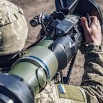 Ukrainian soldier aims an NLAW