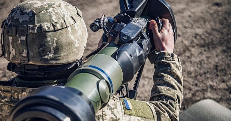Ukrainian soldier aims an NLAW
