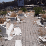 Defaced graves in a Kurdish graveyard