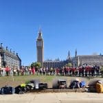 Millions Missing protesters standing against the backdrop of the UK parliament for ME