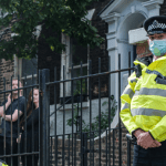 two police officers look at the camera