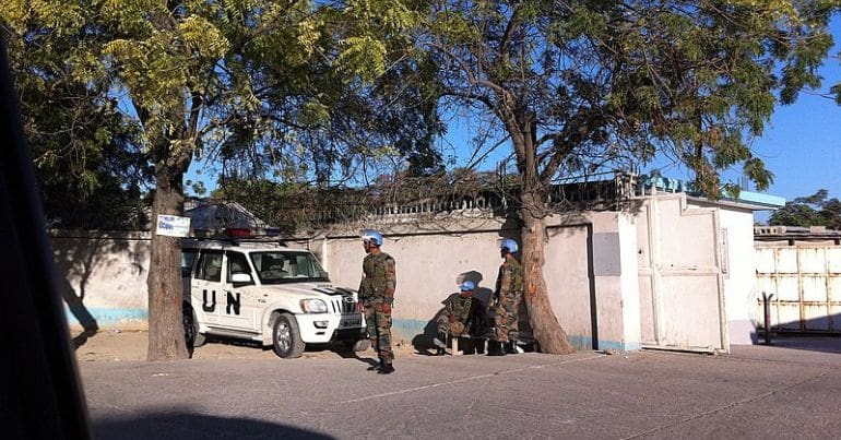 UN troops stand by their vehicles in Haiti