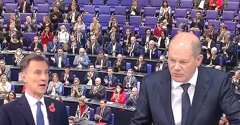 The German parliament with pictures of both the UK and German finance ministers