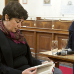 Joanne Harris is pictured reading a book