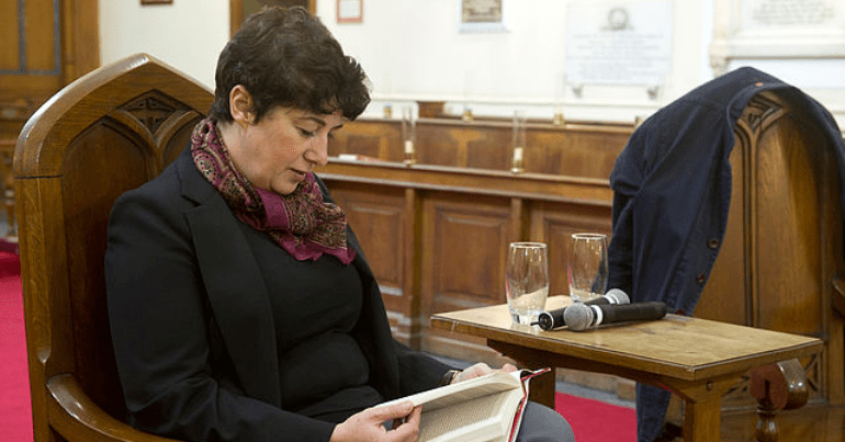 Joanne Harris is pictured reading a book