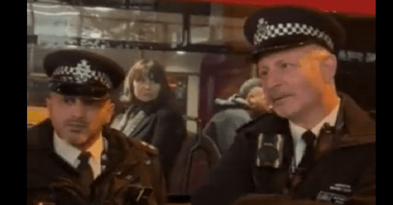 two officers outside stoke newington station