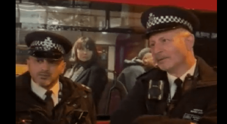 two officers outside stoke newington station