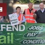 An RMT picket line and the BBC logo