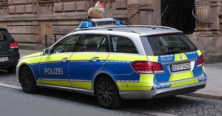 A German police car parked in a street.