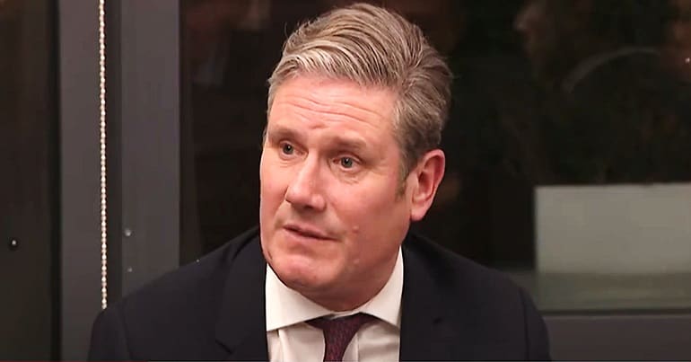 Keir Starmer looking to the left