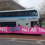 XR Youth Bristol blocking an airport shuttle bus