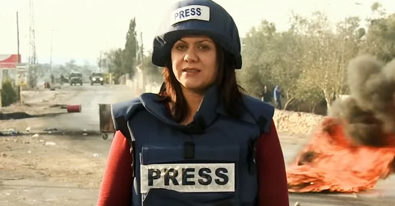 Shireen Abu Akleh in 'PRESS' helmet and flak jacket