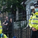 Met police officers looking at the camera
